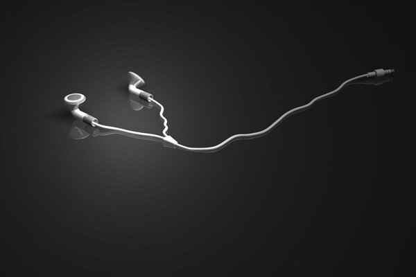 Le cuffie bianche si trovano su uno sfondo grigio a specchio