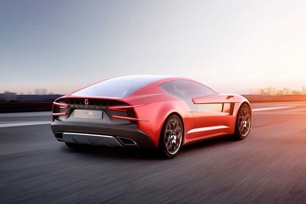 Super car rossa alla velocità sulla strada