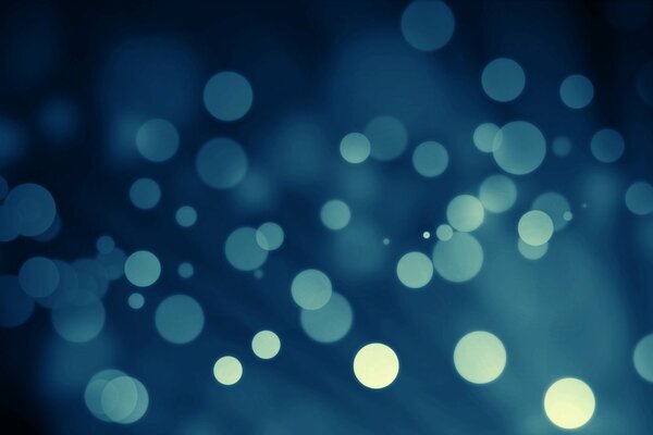 Bokeh blu su sfondo blu