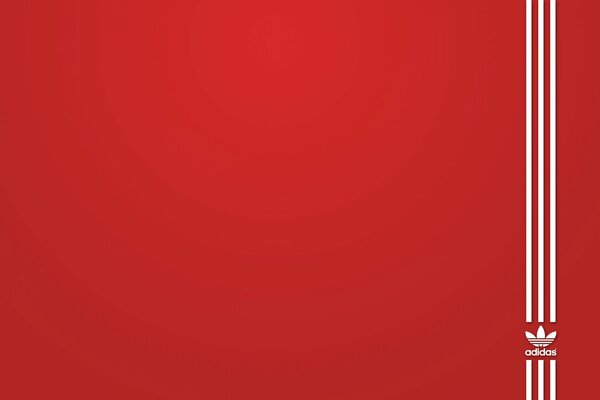 Logo Adidas su sfondo rosso