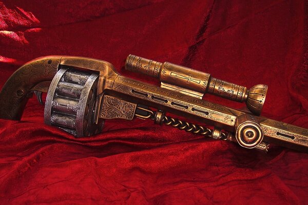 Revolver bronzo su velluto rosso