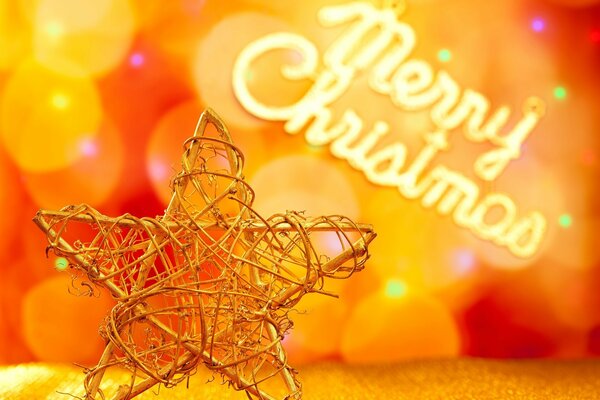 Stella di Natale in metallo con bokeh e lettere di Buon Natale